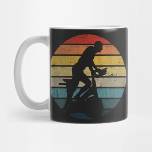 Exercise Bike Silhouette On A Distressed Retro Sunset print Mug